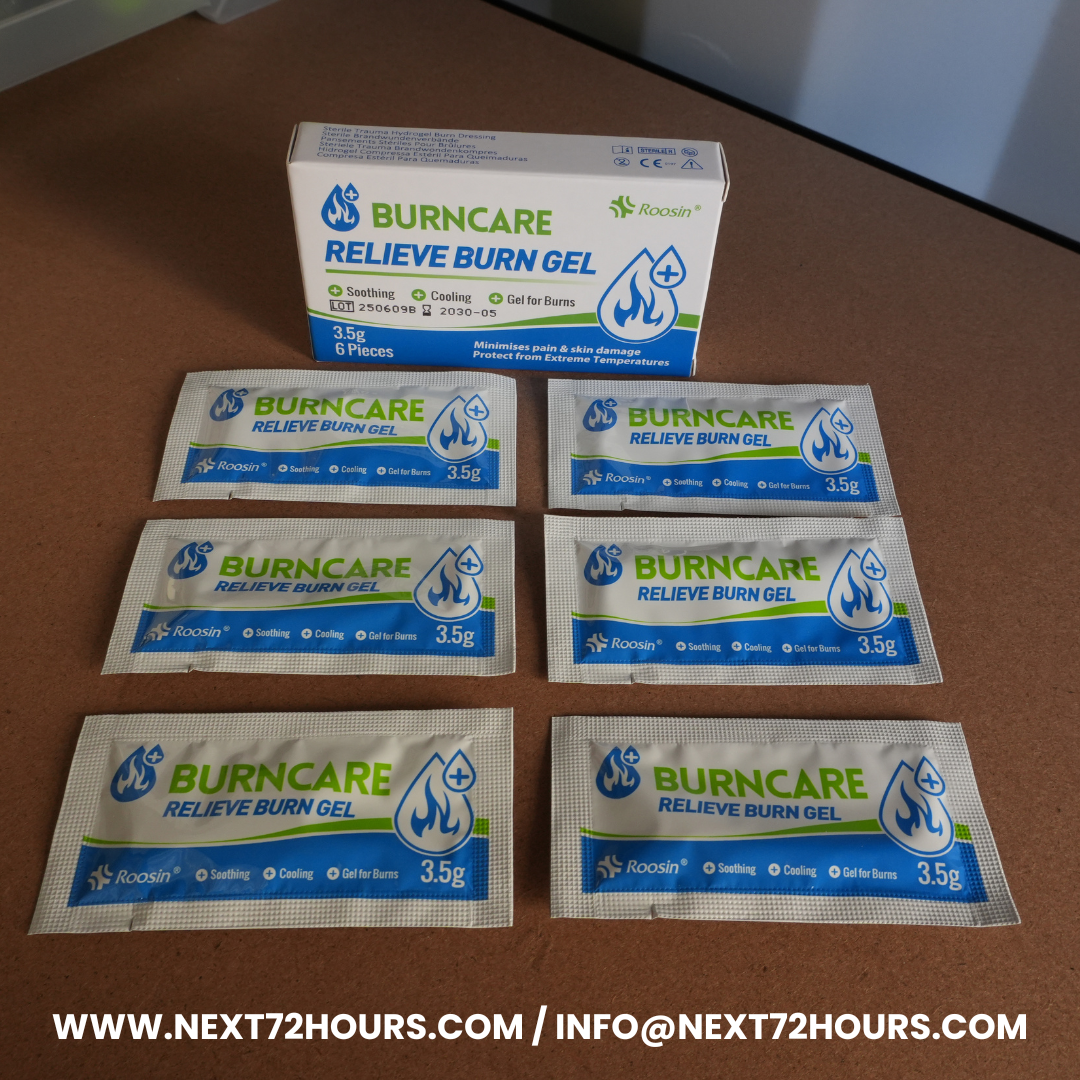 New Zealand Survival Kit Addition Burn Gel Packaging spread out on a Brown Back Ground